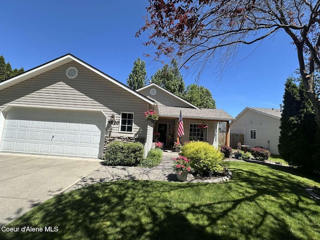 5820 E Steamboat Bnd, Post Falls, ID 83854 - ranch-style house with an attached garage, a front lawn, and concrete driveway
