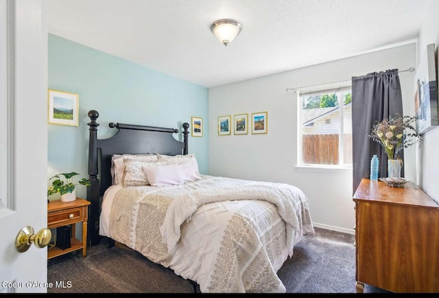 5820 E Steamboat Bnd, Post Falls, ID 83854 - bedroom with dark colored carpet and baseboards