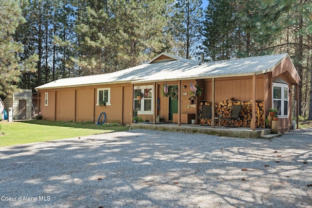 490 Samuels Rd, Sandpoint, ID 83864 - view of front of home featuring metal roof and a front yard