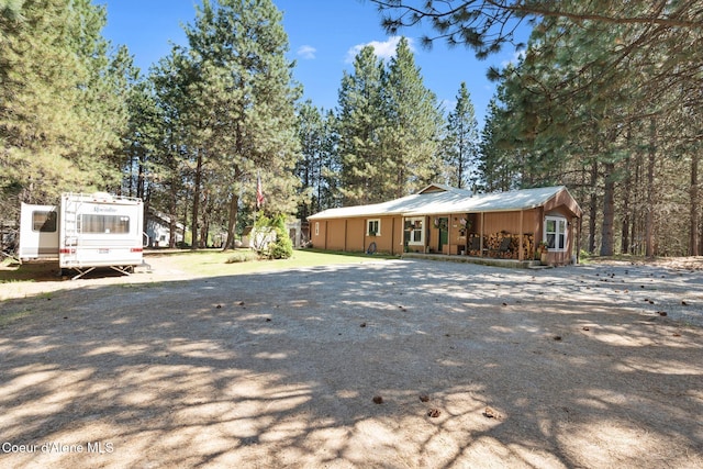 490 Samuels Rd, Sandpoint, ID 83864 - view of home's exterior featuring gravel driveway