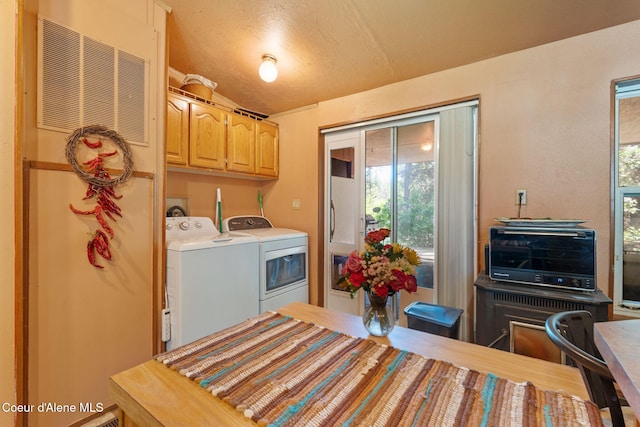 490 Samuels Rd, Sandpoint, ID 83864 - washroom with washer and dryer, healthy amount of natural light, and cabinet space