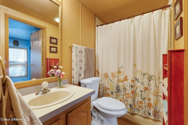 490 Samuels Rd, Sandpoint, ID 83864 - full bathroom featuring vanity, toilet, and curtained shower