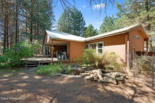 490 Samuels Rd, Sandpoint, ID 83864 - rear view of property with a deck and metal roof