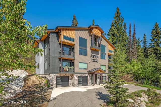 227 Crystal Springs Rd # 3, Sandpoint, ID 83864 - view of building exterior with an attached garage and driveway
