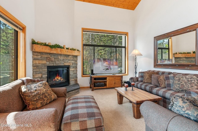 227 Crystal Springs Rd # 3, Sandpoint, ID 83864 - living room featuring carpet, a fireplace, and a towering ceiling