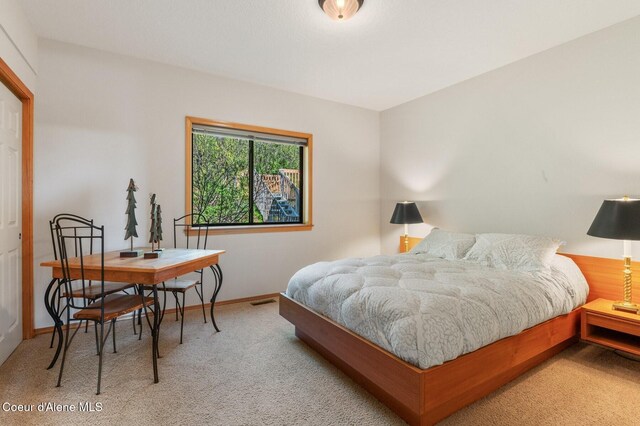 227 Crystal Springs Rd # 3, Sandpoint, ID 83864 - bedroom with light carpet and baseboards