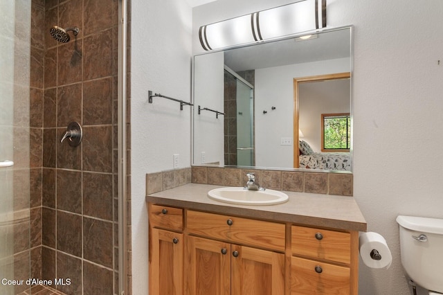 227 Crystal Springs Rd # 3, Sandpoint, ID 83864 - ensuite bathroom with a tile shower, vanity, and toilet