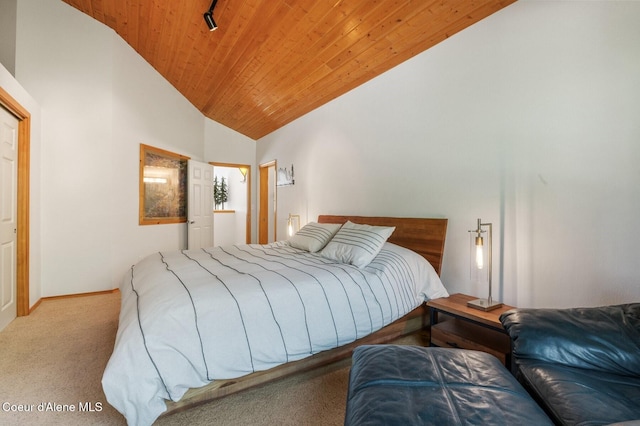 227 Crystal Springs Rd # 3, Sandpoint, ID 83864 - bedroom with carpet, wooden ceiling, baseboards, and high vaulted ceiling