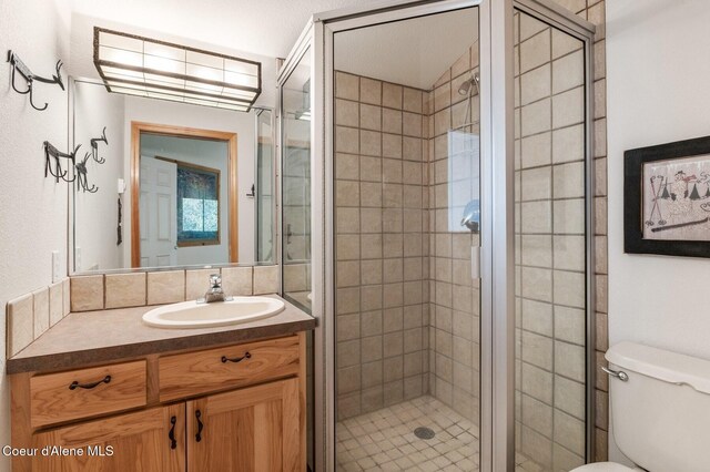 227 Crystal Springs Rd # 3, Sandpoint, ID 83864 - bathroom with toilet, vanity, and a stall shower