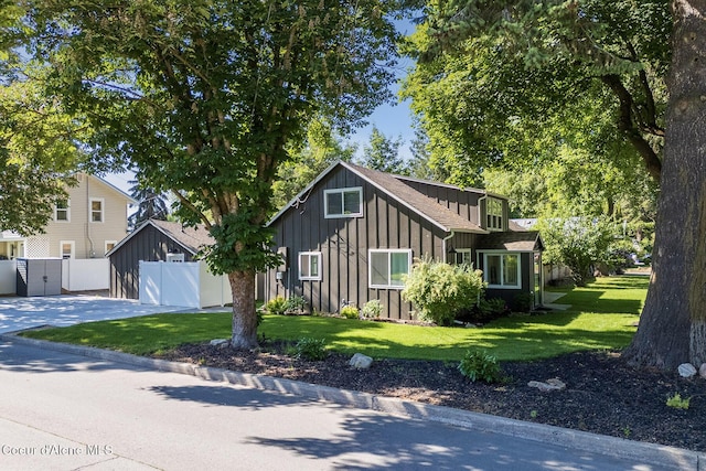 901 N 16th St, Coeur Dalene, ID 83814 - view of front of property featuring board and batten siding, driveway, and a garage