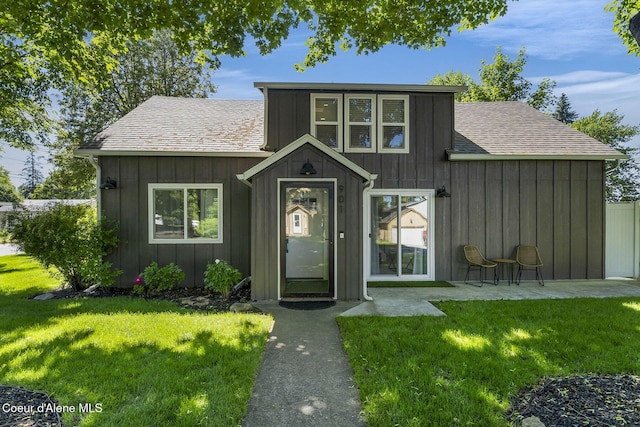 901 N 16th St, Coeur Dalene, ID 83814 - view of front of house featuring roof with shingles, board and batten siding, and a front yard