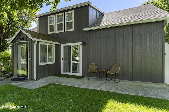 901 N 16th St, Coeur Dalene, ID 83814 - back of property featuring a yard, a shingled roof, and a patio