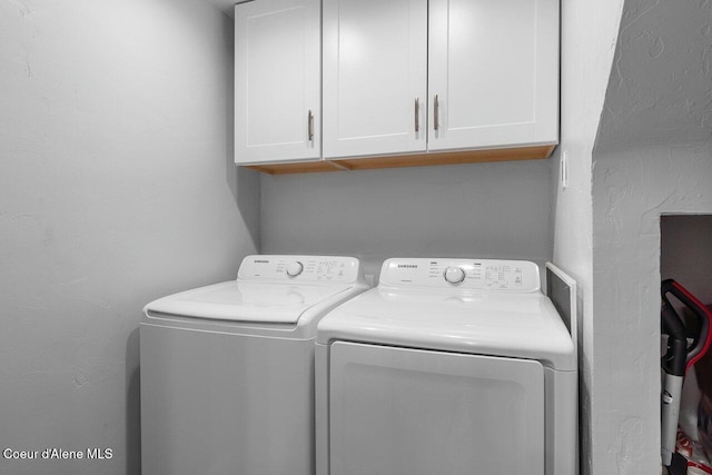 228 Snowgoose Ln Unit 8, Sandpoint, ID 83864 - laundry area featuring independent washer and dryer and cabinet space