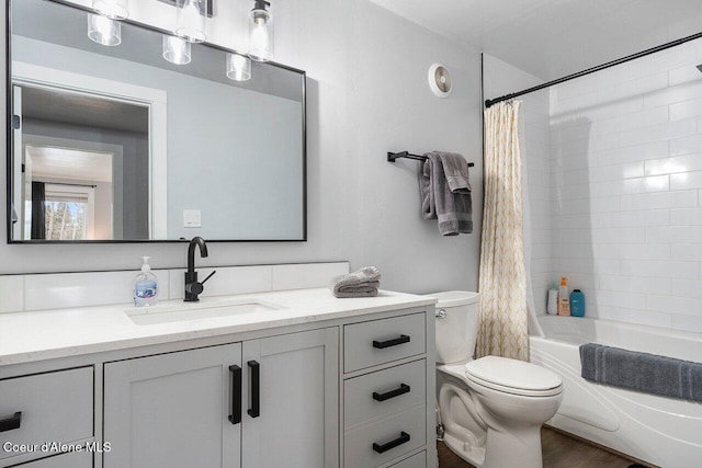 228 Snowgoose Ln Unit 8, Sandpoint, ID 83864 - bathroom featuring toilet, vanity, and shower / bath combination with curtain