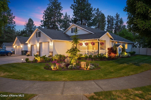 5835 E Steamboat Bnd, Post Falls, ID 83854 - view of front facade with covered porch, concrete driveway, and a garage