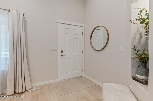 5835 E Steamboat Bnd, Post Falls, ID 83854 - entryway with light wood-style floors and baseboards