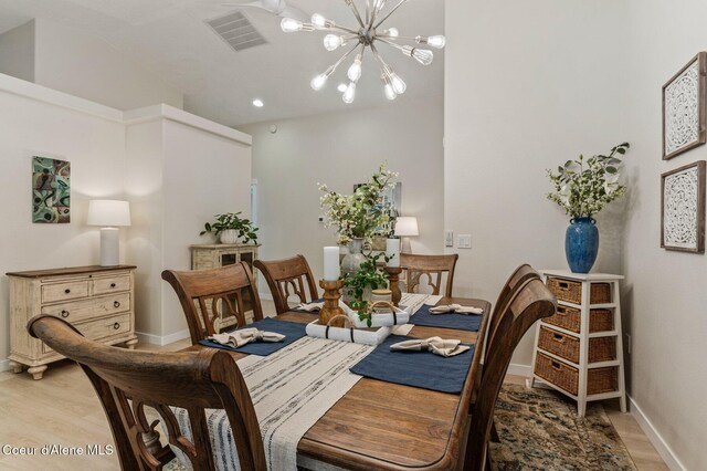 5835 E Steamboat Bnd, Post Falls, ID 83854 - dining area featuring light wood finished floors, baseboards, a chandelier, and recessed lighting