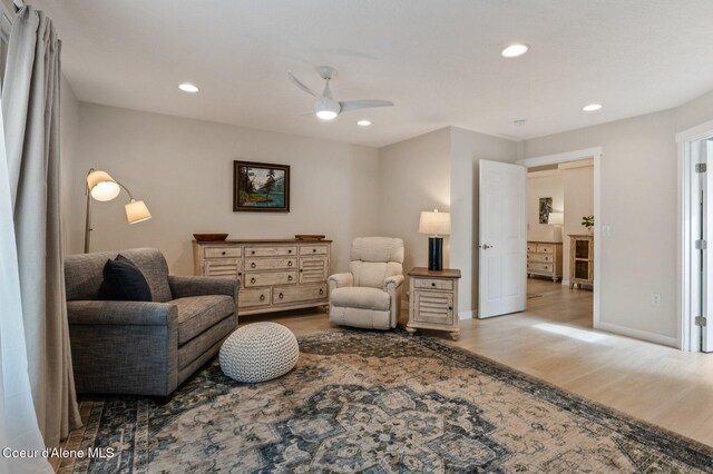 5835 E Steamboat Bnd, Post Falls, ID 83854 - sitting room featuring wood finished floors, ceiling fan, recessed lighting, and baseboards