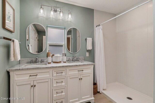 5835 E Steamboat Bnd, Post Falls, ID 83854 - full bath with a tile shower and double vanity