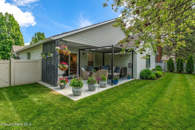 5835 E Steamboat Bnd, Post Falls, ID 83854 - rear view of house with a patio and outdoor lounge area