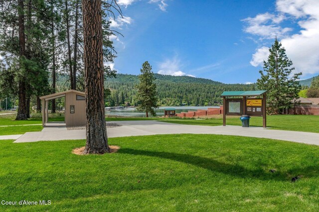 5835 E Steamboat Bnd, Post Falls, ID 83854 - view of community with a lawn, a forest view, and a mountain view