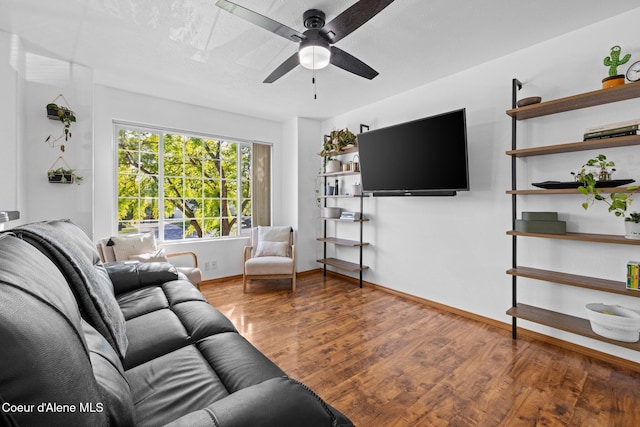 688 N Sparklewood Ct, Post Falls, ID 83854 - living area featuring a ceiling fan, wood finished floors, and baseboards