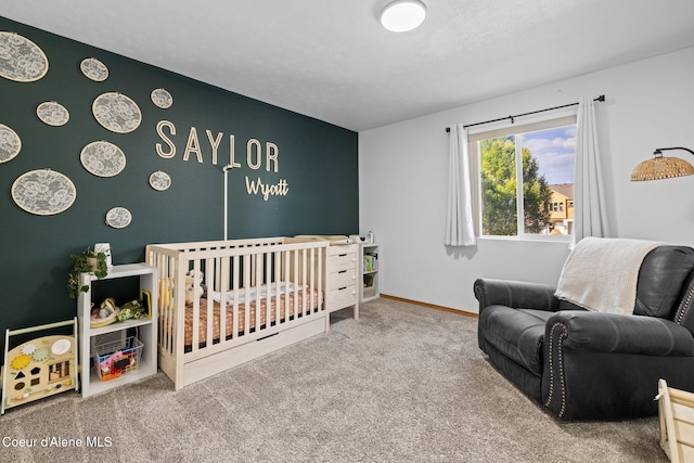688 N Sparklewood Ct, Post Falls, ID 83854 - carpeted bedroom with a crib and baseboards