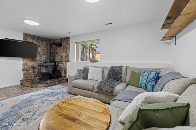 688 N Sparklewood Ct, Post Falls, ID 83854 - living room with a wood stove and baseboards