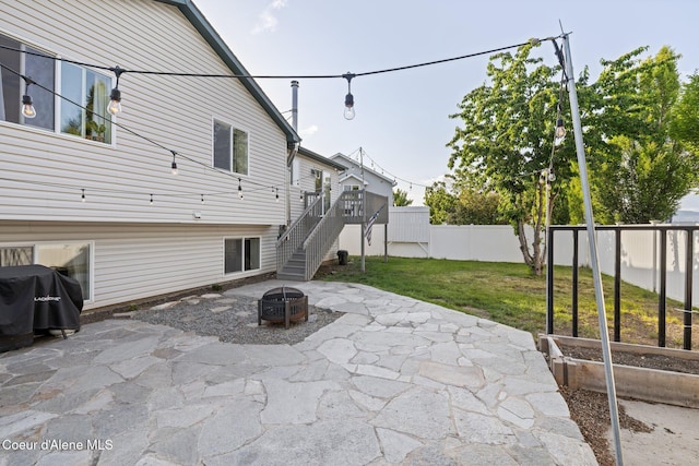688 N Sparklewood Ct, Post Falls, ID 83854 - view of patio featuring a fire pit, stairway, and a grill