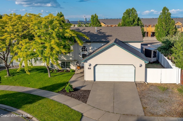 688 N Sparklewood Ct, Post Falls, ID 83854 - view of front of home with driveway, a garage, a residential view, and a gate