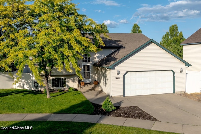 688 N Sparklewood Ct, Post Falls, ID 83854 - view of front facade with an attached garage, driveway, and a shingled roof