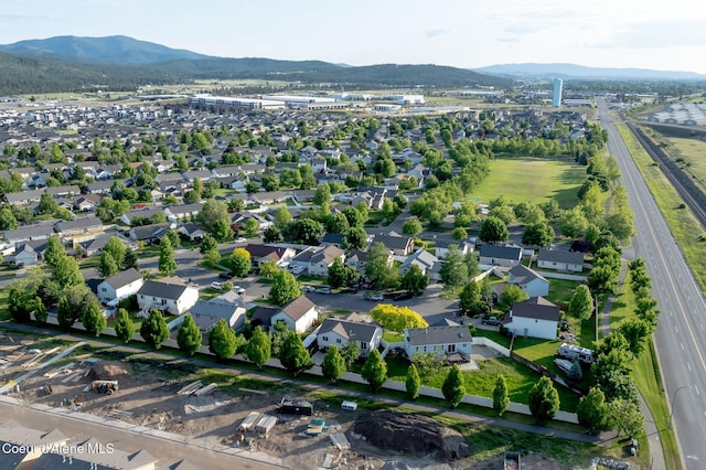 688 N Sparklewood Ct, Post Falls, ID 83854 - aerial overview of property's location with mountains and nearby suburban area