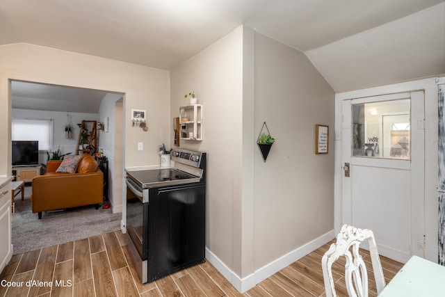 1409 E Birch Ave, Coeur Dalene, ID 83814 - kitchen with electric range oven, light wood-style flooring, baseboards, and vaulted ceiling