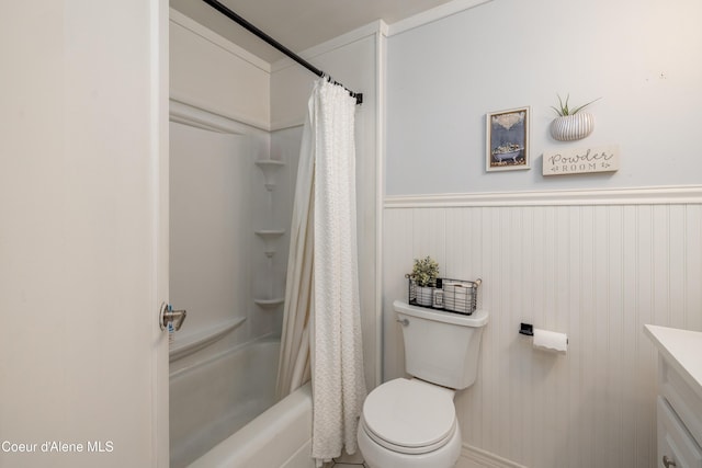 1409 E Birch Ave, Coeur Dalene, ID 83814 - bathroom featuring vanity, toilet, shower / tub combo with curtain, and wainscoting