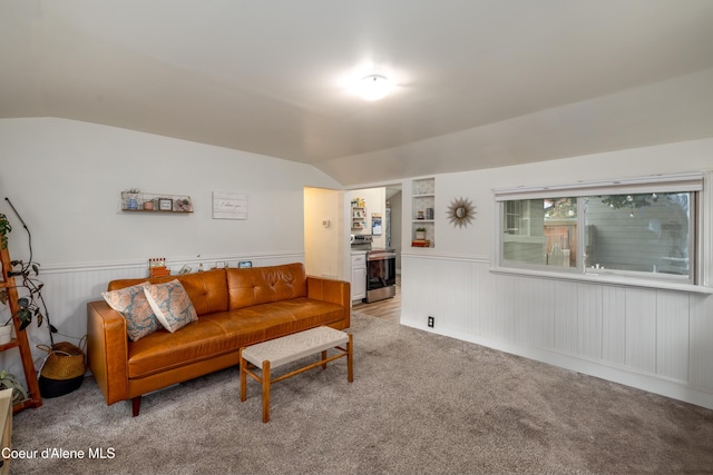 1409 E Birch Ave, Coeur Dalene, ID 83814 - living room featuring lofted ceiling, light carpet, and wainscoting