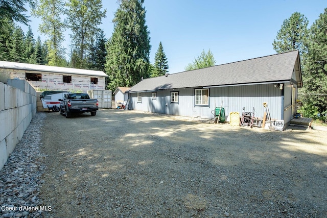 511 E Spring St, Oldtown, ID 83822 - rear view of house featuring roof with shingles