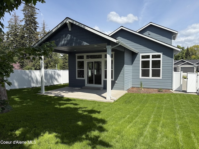 9151 N Raintree Ln, Hayden, ID 83835 - back of house featuring a gate and a patio