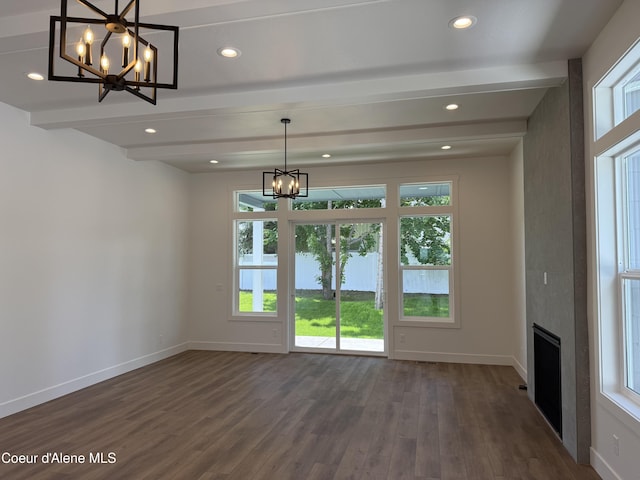 9151 N Raintree Ln, Hayden, ID 83835 - unfurnished dining area featuring a chandelier, dark wood-style flooring, beam ceiling, plenty of natural light, and recessed lighting