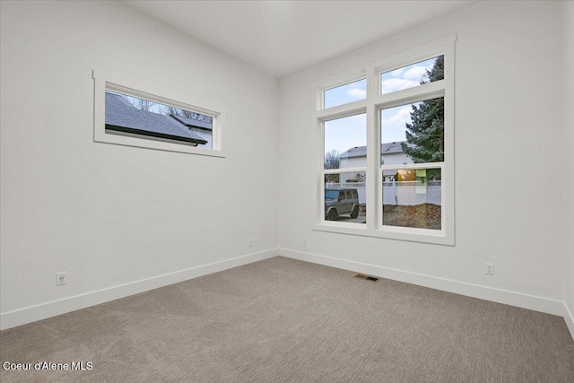 9151 N Raintree Ln, Hayden, ID 83835 - spare room with baseboards and carpet