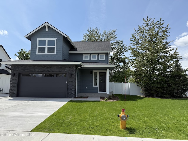 9151 N Raintree Ln, Hayden, ID 83835 - view of front of house featuring a garage, driveway, and brick siding