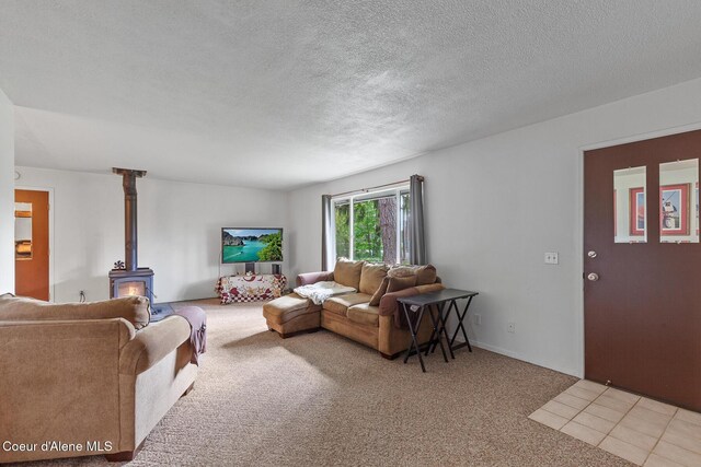 15248 N Atlas Rd, Rathdrum, ID 83858 - living area with a wood stove, light colored carpet, and a textured ceiling