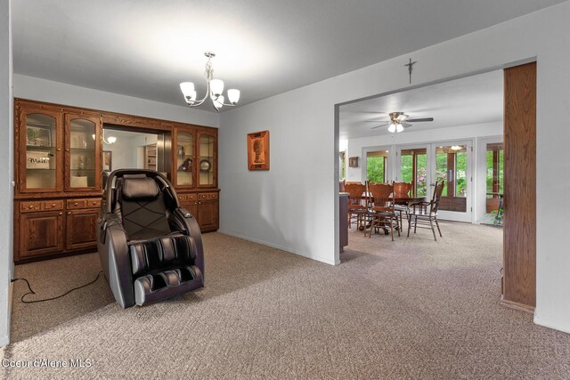 15248 N Atlas Rd, Rathdrum, ID 83858 - dining room featuring light colored carpet, a chandelier, baseboards, and a ceiling fan