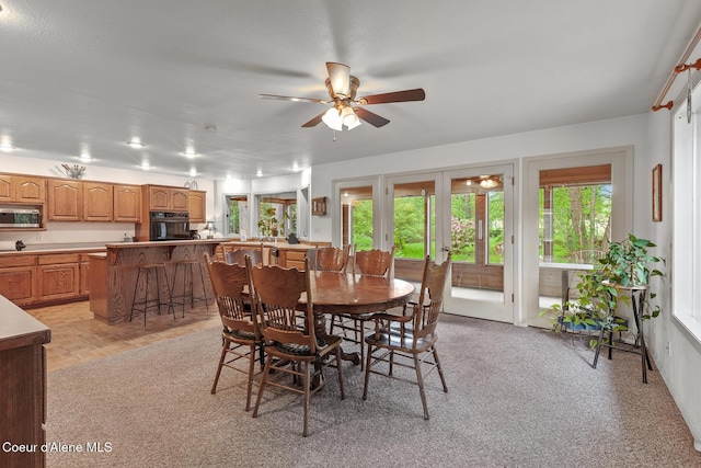 15248 N Atlas Rd, Rathdrum, ID 83858 - dining space with ceiling fan, plenty of natural light, and french doors