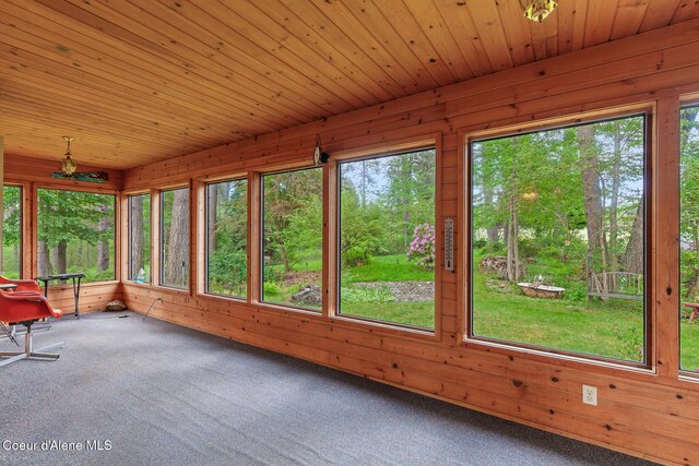 15248 N Atlas Rd, Rathdrum, ID 83858 - unfurnished sunroom with carpet floors, wooden walls, and wooden ceiling