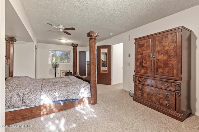 15248 N Atlas Rd, Rathdrum, ID 83858 - bedroom with a textured ceiling, decorative columns, carpet flooring, and ceiling fan