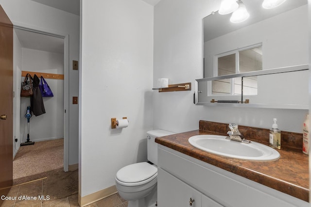15248 N Atlas Rd, Rathdrum, ID 83858 - bathroom featuring toilet, vanity, and tile patterned flooring