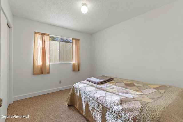 15248 N Atlas Rd, Rathdrum, ID 83858 - carpeted bedroom with a textured ceiling and baseboards