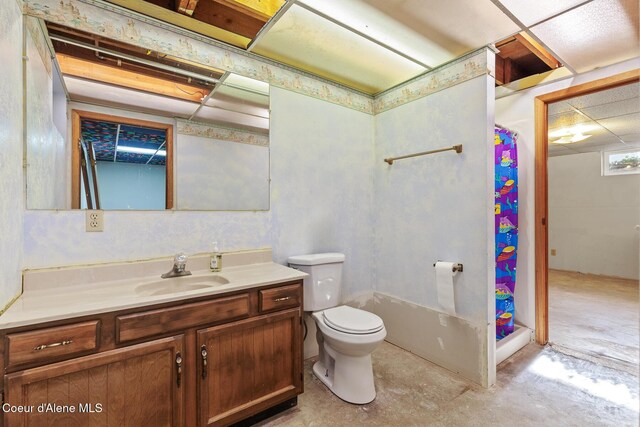 15248 N Atlas Rd, Rathdrum, ID 83858 - bathroom with vanity, unfinished concrete floors, toilet, and a shower with shower curtain