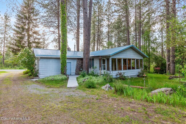 15248 N Atlas Rd, Rathdrum, ID 83858 - view of front facade with a sunroom and metal roof