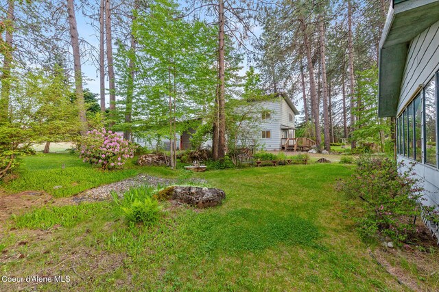 15248 N Atlas Rd, Rathdrum, ID 83858 - view of grassy yard featuring a wooden deck